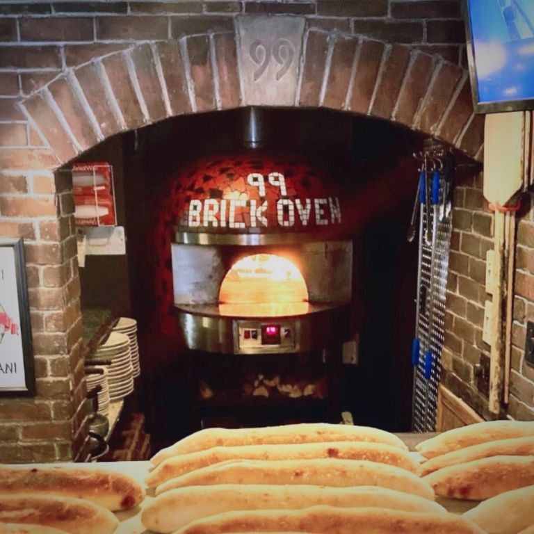 Customer 99 Brick Oven using Marra Forni's commercial wood-fired oven image